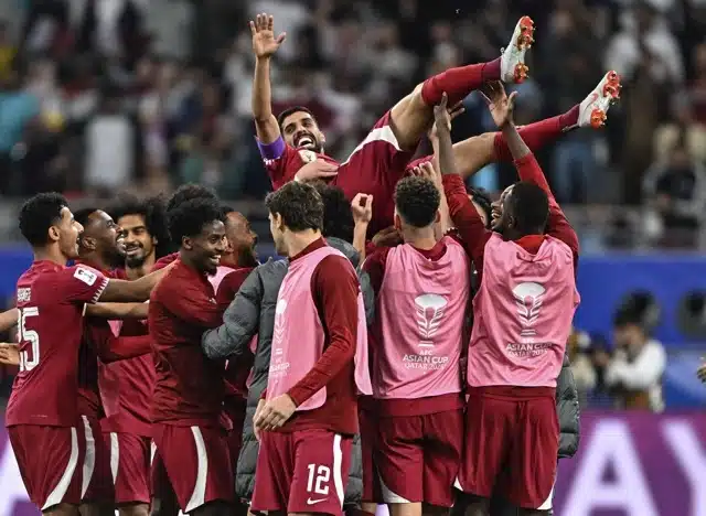 AFC Asian Cup Hasan Al Haydos, wearing the number 10 jersey for Qatar, is celebrating a goal with his teammates during the AFC Asian Cup 2023 match