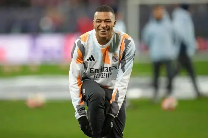 Real Madrid's Kylian Mbappe smiles during the warm up