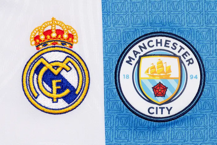 Close up of Manchester City & Real Madrid club logo