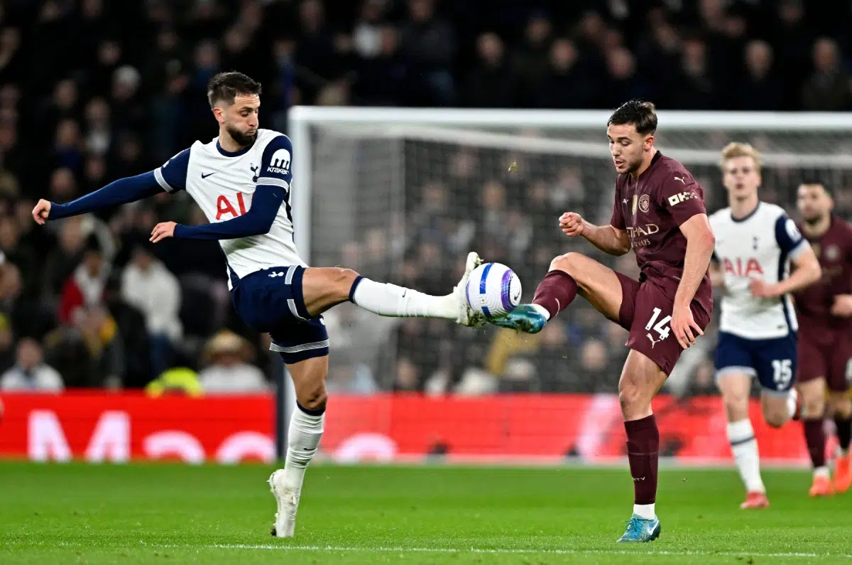 Rodrigo Bentancur (Spurs) and Nico Gonzalez (Manchester City) during the Tottenham Hotspur V Manchester City Barclays Premier League match