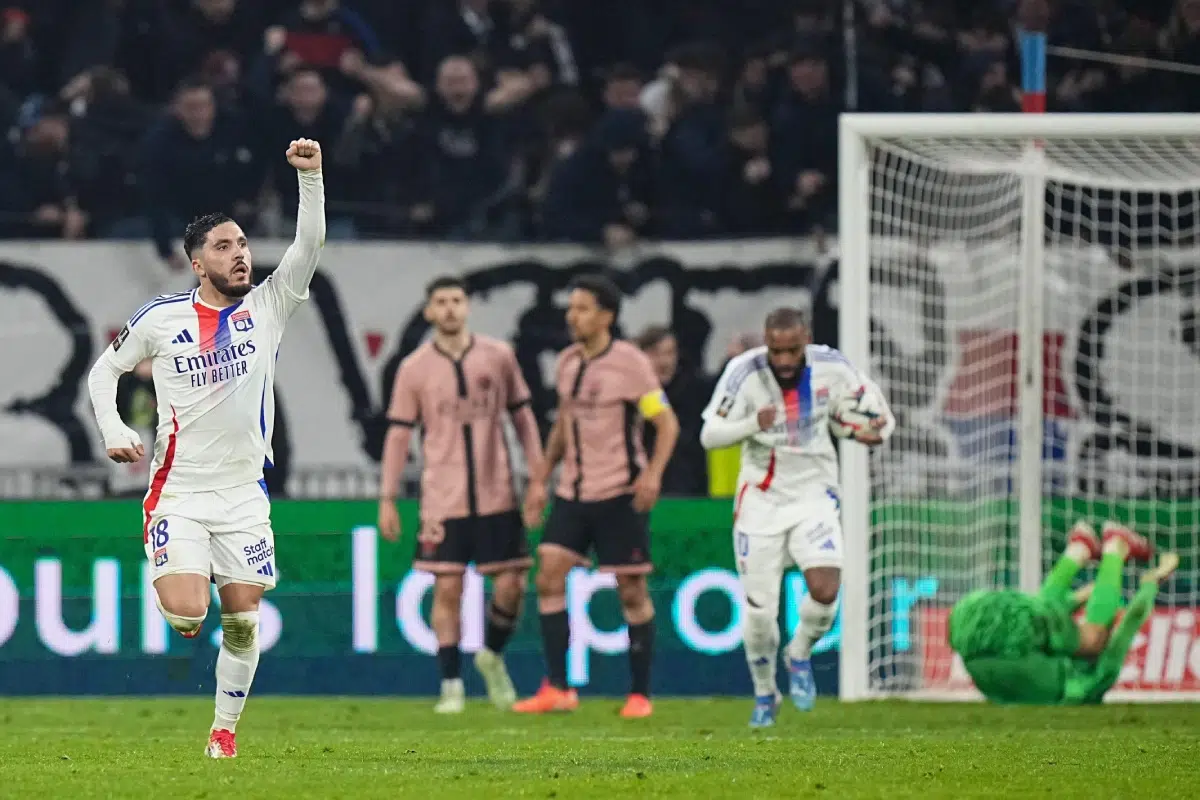 Lyon's Rayan Cherki celebrates after scoring his side's opening goal during the French League One soccer match