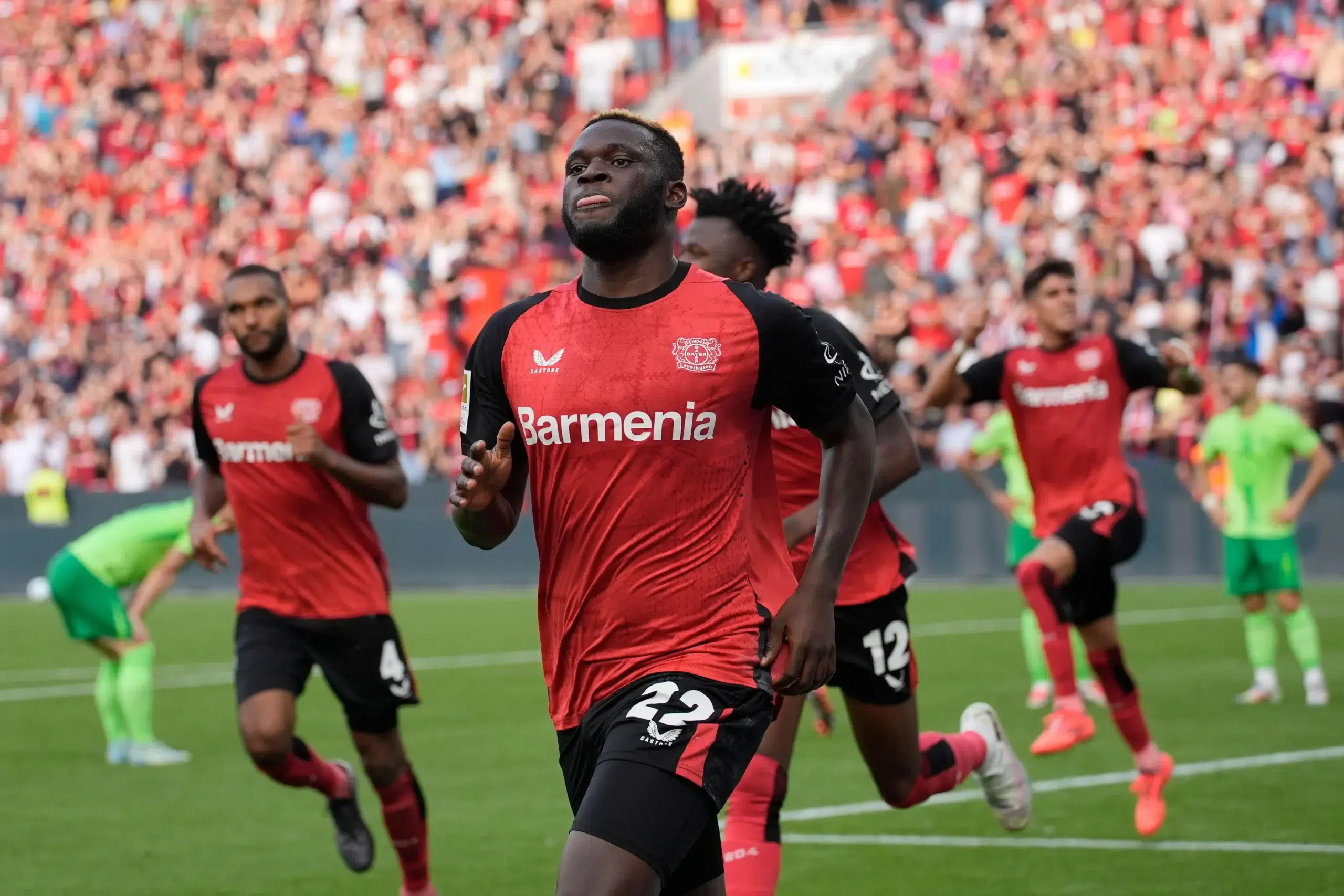 Leverkusen's Victor Boniface celebrates after he scored during the German Bundesliga soccer match