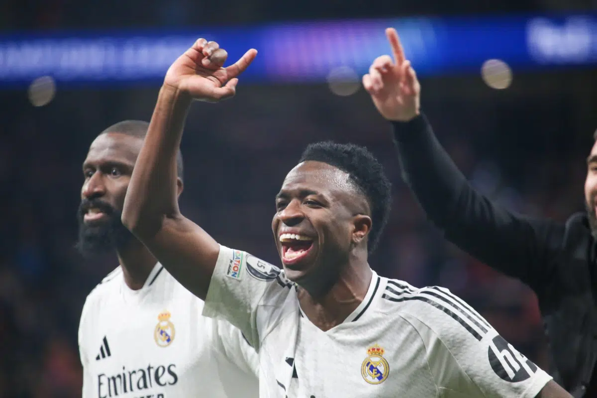 Real Madrid's Vinicius Júnior celebrates reaching the quarterfinals during the 2024-25 UEFA Champions League