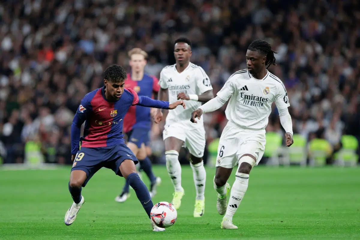 Lamine Yamal of Barcelona and Eduardo Camavinga of Real Madrid fight for the ball, El Clasico 2024