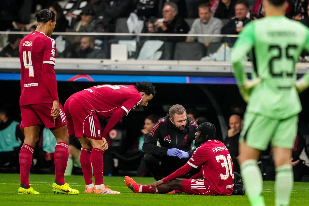 Jeremie Frimpong of Liverpool receives medical treatment during the UEFA Champions League 2025/26 match