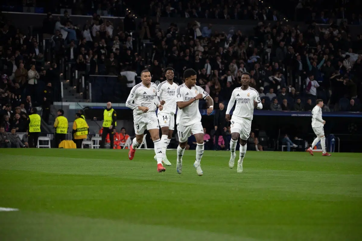 A group of Real Madrid footballers celebrate a goal during the UEFA Champions League Round of 16 first leg match