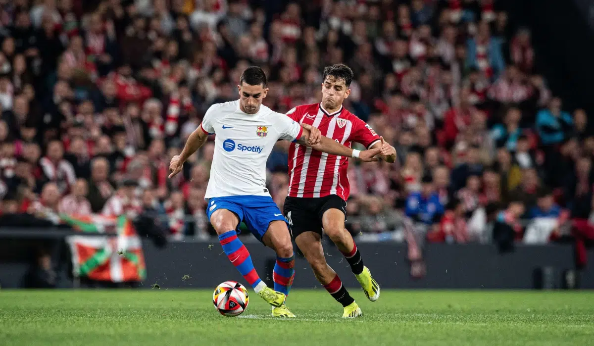 Ferran Torres of FC Barcelona and Benat Prados of Athletic Club fight for the ball during the Copa del Rey Quarter Final match, 2024