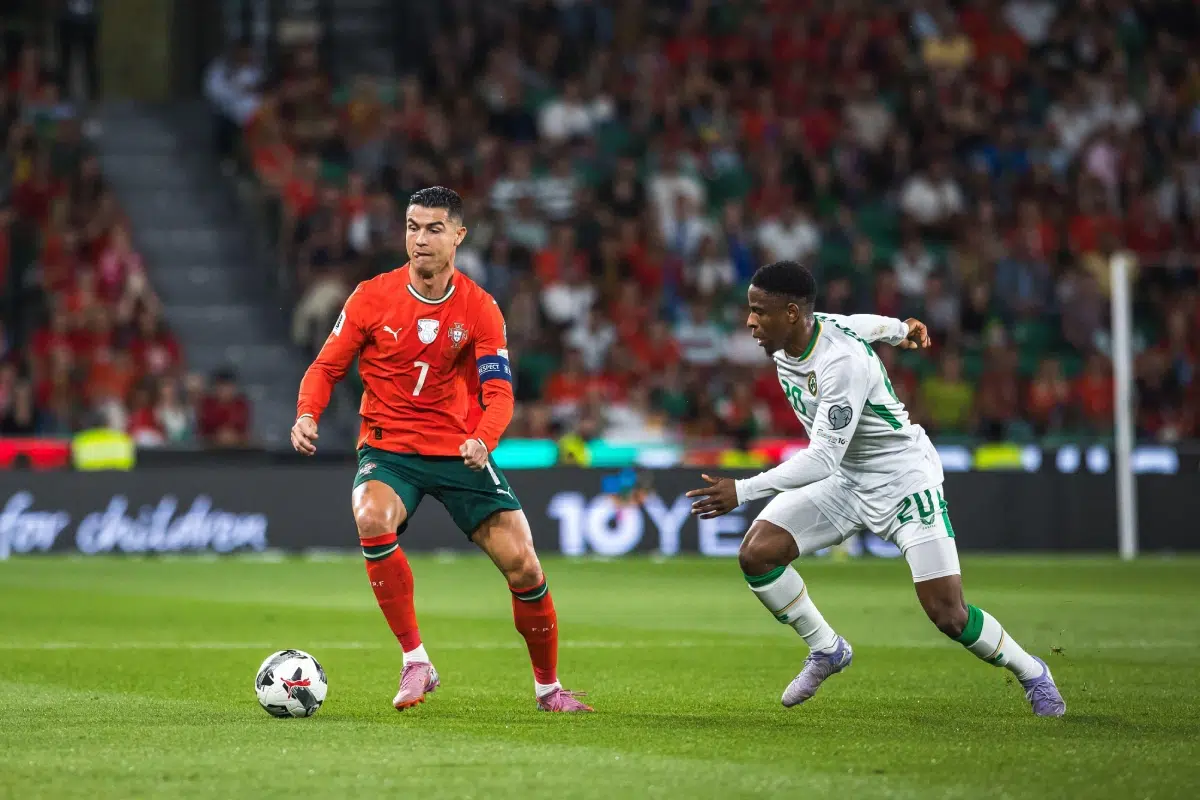Cristiano Ronaldo of Portugal and Chiedozie Ogbene of Republic of Ireland seen in action during the FIFA World Cup 2026 qualifier match