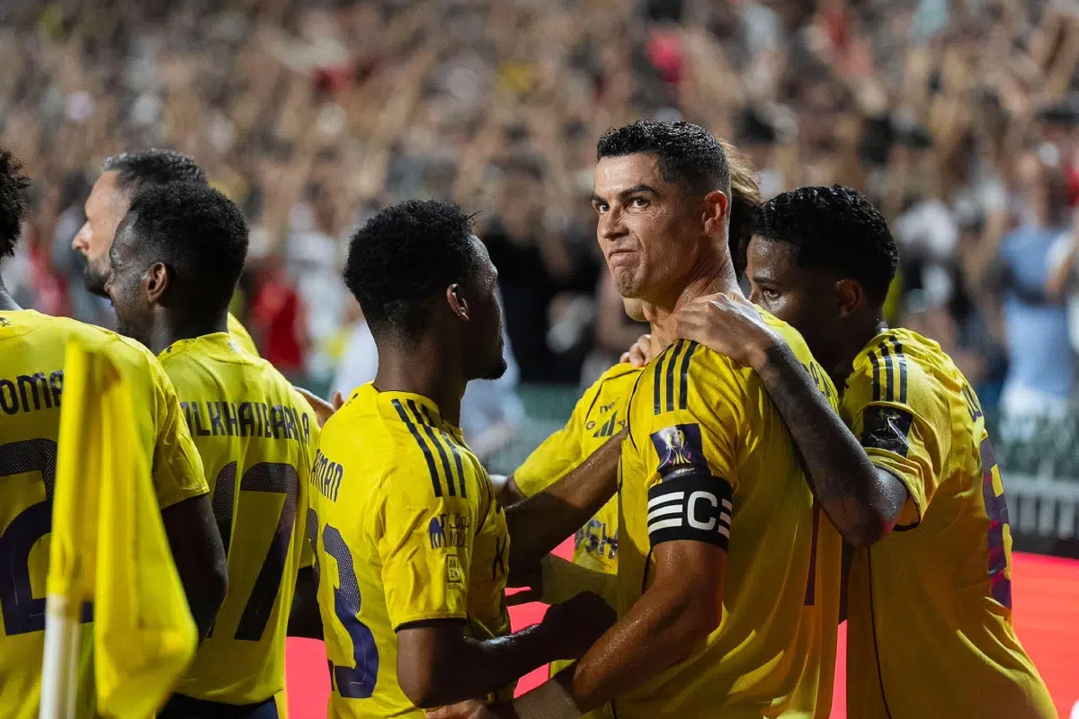 Al Nassr's Cristiano Ronaldo celebrates with teammates after scoring a goal, 2025