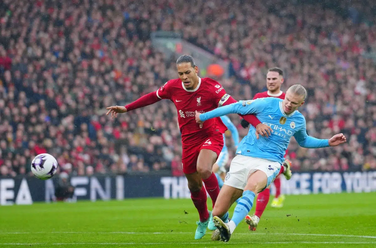 Liverpool's Virgil van Dijk, left, tries to stop Manchester City's Erling Haaland, 2024