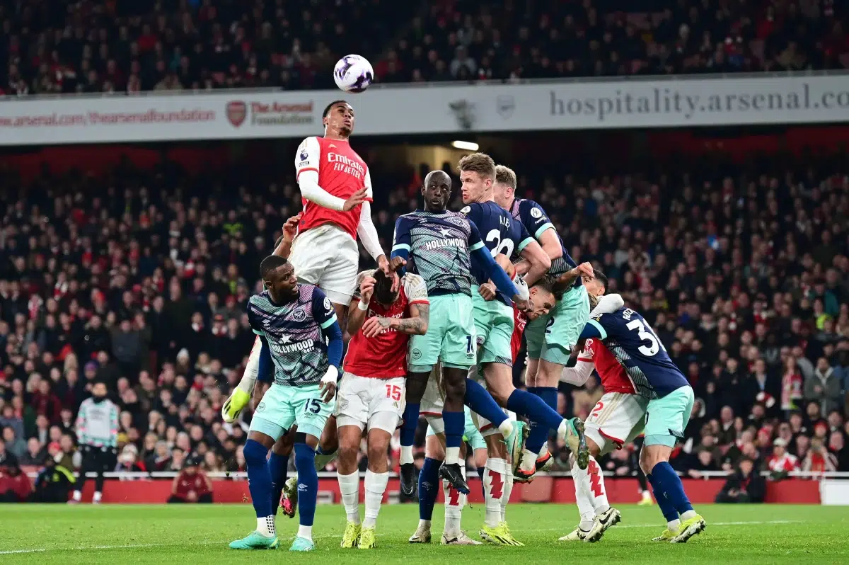 Gabriel of Arsenal FC rises to the crossed ball to threaten the Brentford goal, 2024