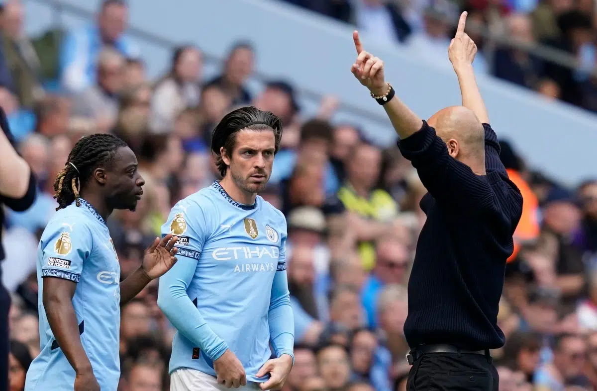 Josep Guardiola coach of Manchester City gives instructions to subs Jack Grealish of Manchester City, 2025