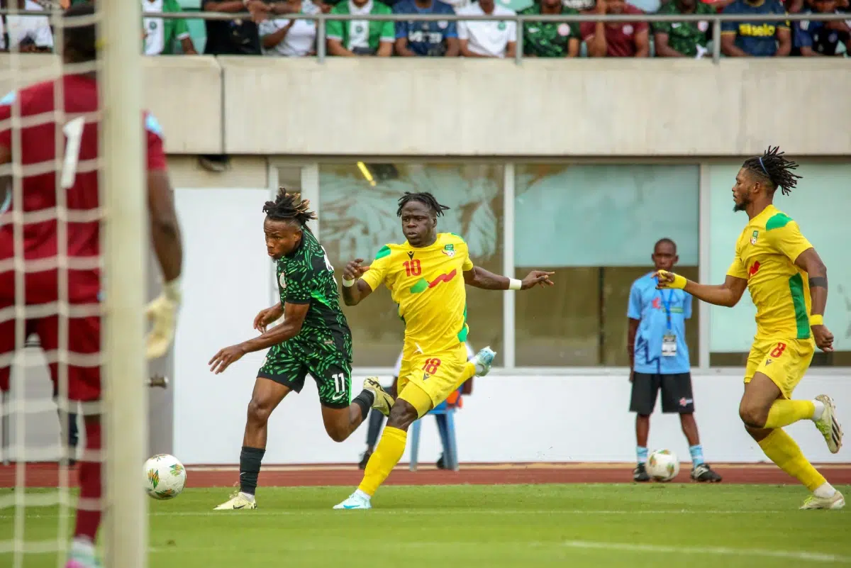 Samuel Chukwueze of Nigeria and Aiyegun Tosin, Imourane Hassane of Benin during the 2025 Africa Cup of Nations