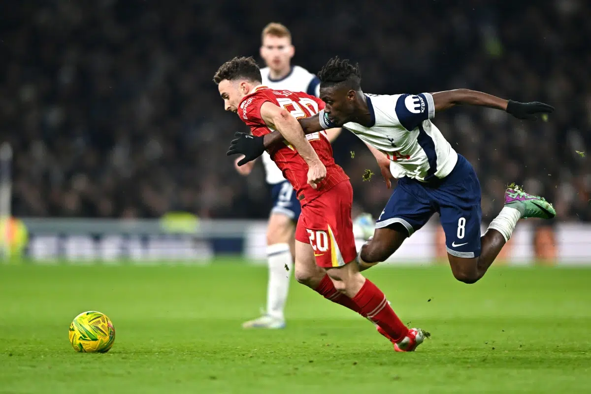 Yves Bissouma of Tottenham Hotspur clashes with Diogo Jota of Liverpool, 2025