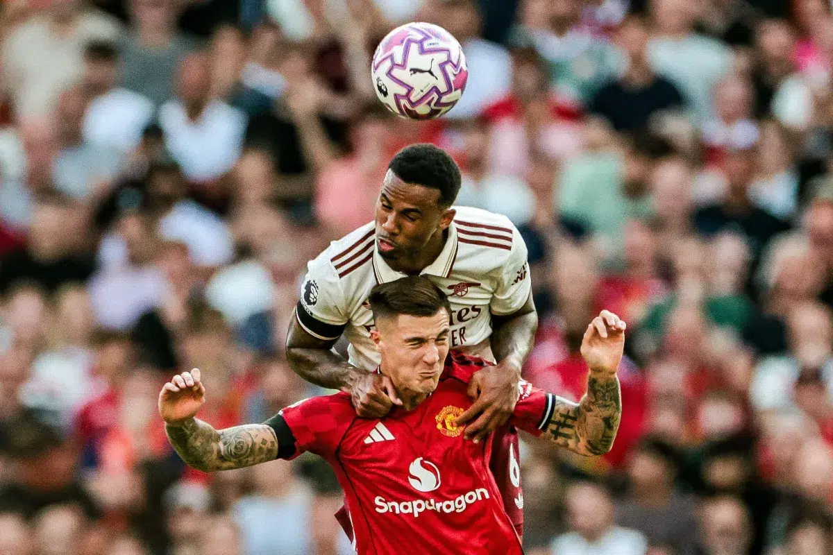 Gabriel Magalhaes of Arsenal battles for the ball with Benjamin Sesko of Manchester United, 2025