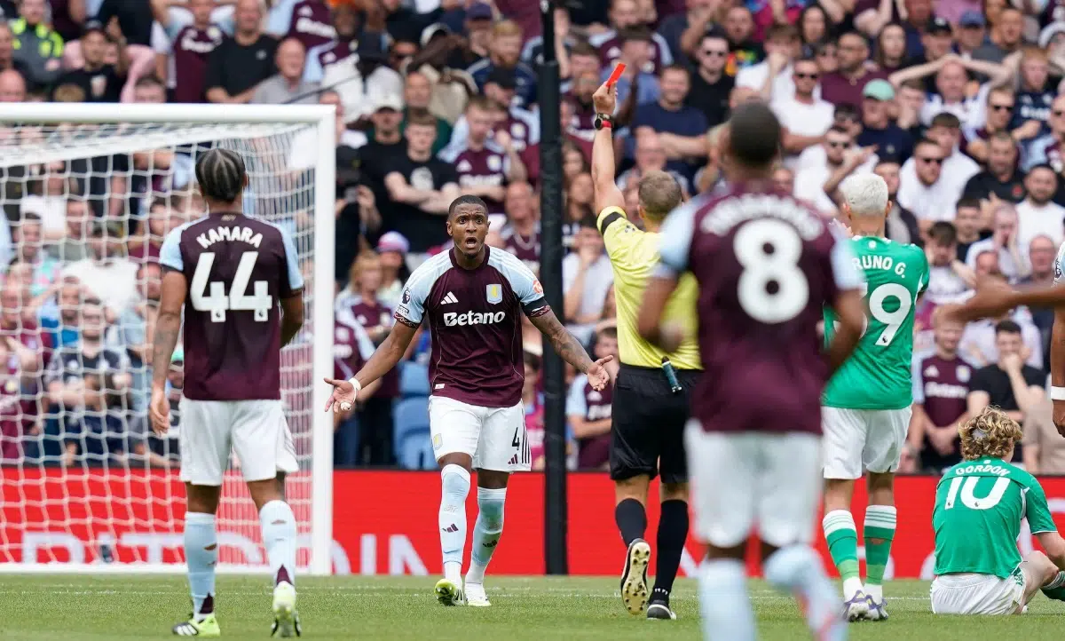 Ezri Konsa of Aston Villa is shown a red card during the Aston Villa vs Newcastle United match, 2025