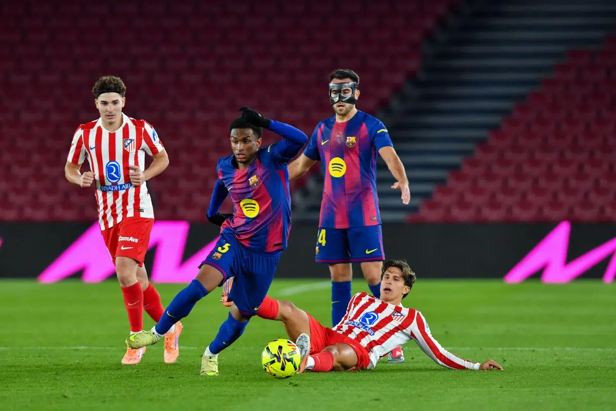Alejandro Balde of FC Barcelona dribbles Giulano of Atletico de Madrid during the match between FC Barcelona and Atletico Madrid, 2nd Dec, 2025