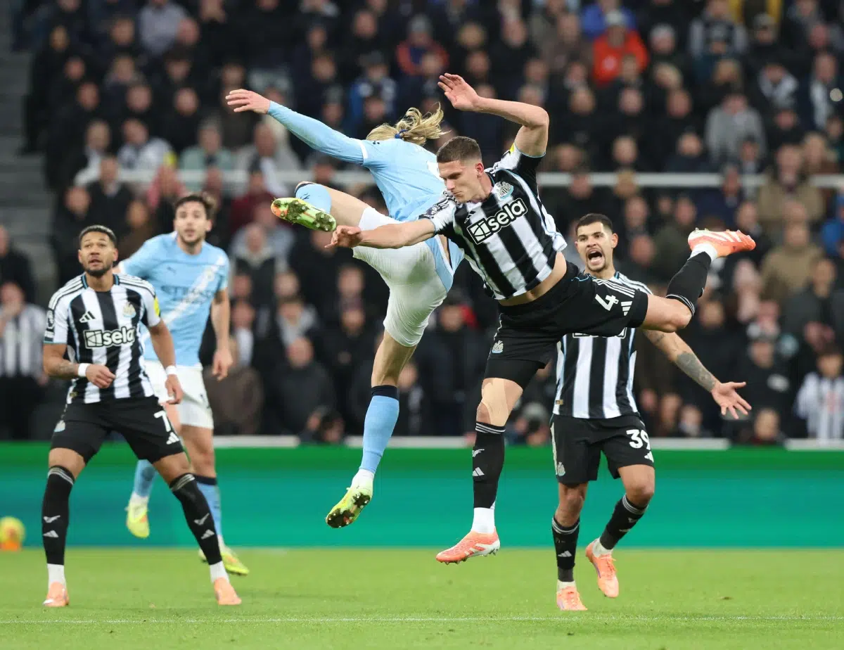 Sven Botman (R) of Newcastle United in action with Erling Haaland of Manchester City, 2025